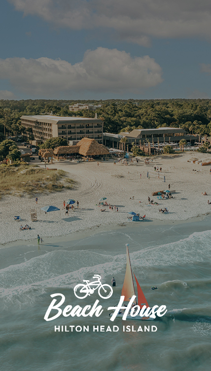 a beach with people and buildings