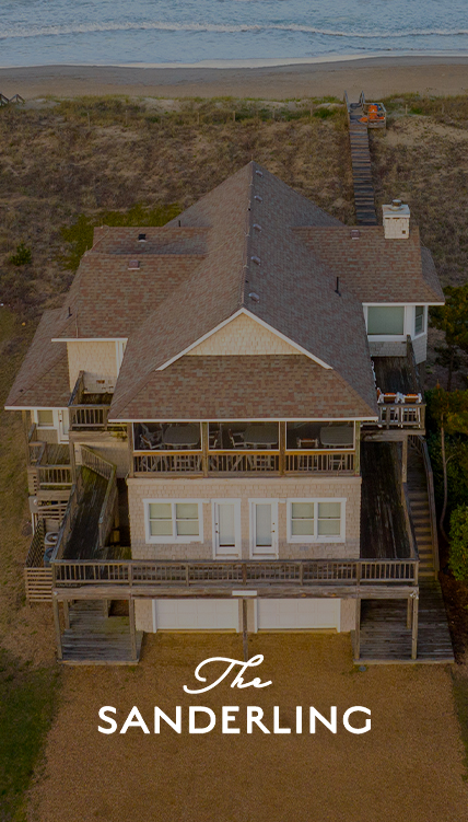 a house with a deck and a garage