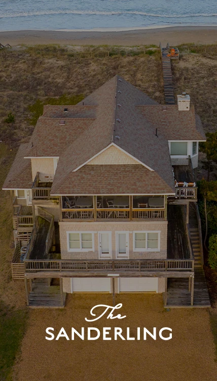 a house with a deck and a garage