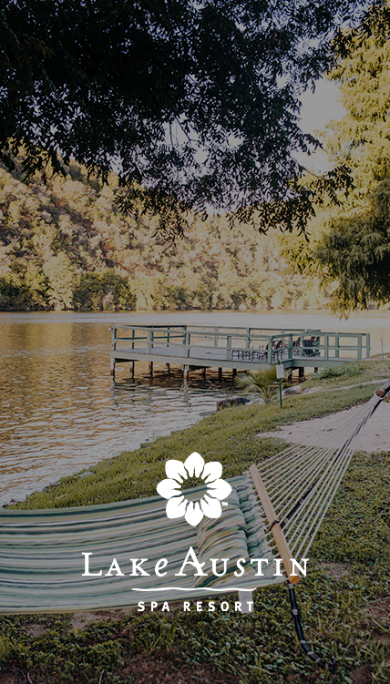 a person on a hammock by a lake