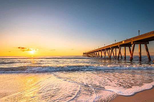 a long wooden bridge over a body of water