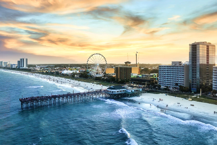 aerial view of myrtle beach while the sun is setting