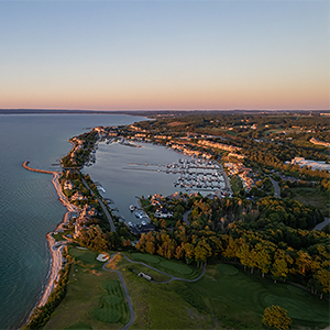 a aerial view of a body of water with a body of water and a city
