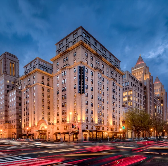 a large building with lights on the side of it