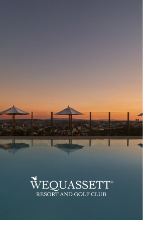 a pool with umbrellas and a city in the background