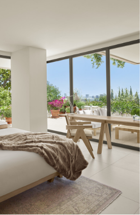 a bedroom with a large window