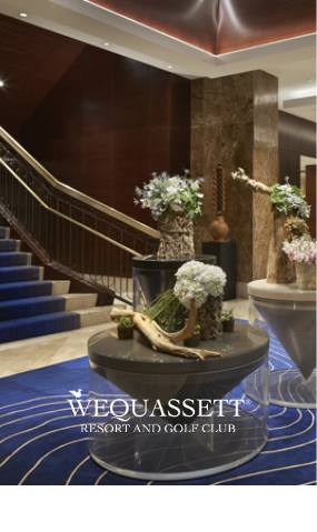 a staircase with a few vases of flowers