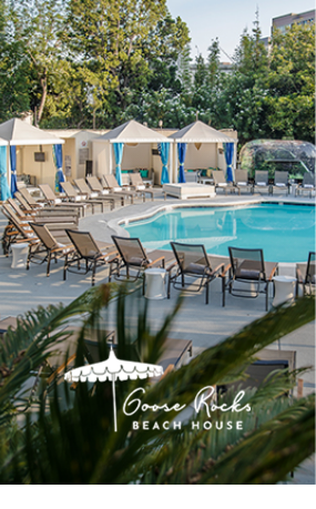 a pool with lounge chairs and umbrellas