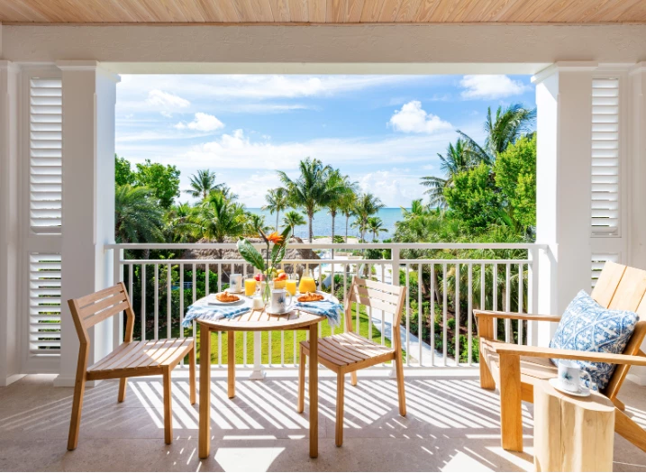 a table and chairs on a balcony