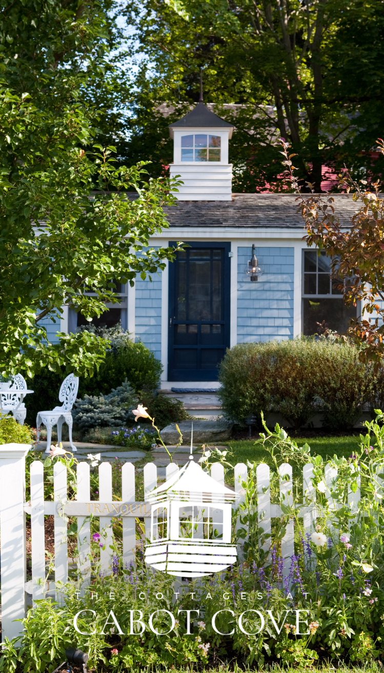 a white picket fence in front of a house