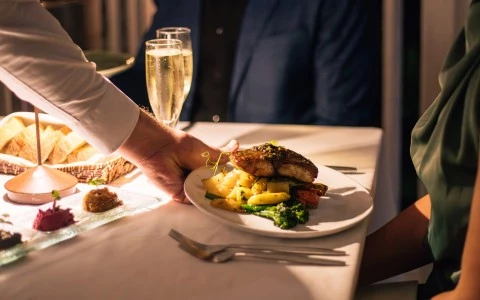 a person holding a plate of food