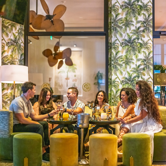 a group of people sitting around a table
