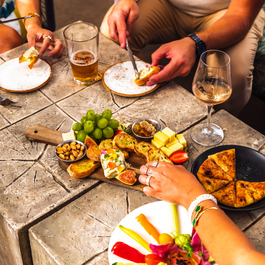 a group of people eating food at a table