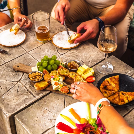 a group of people eating food at a table