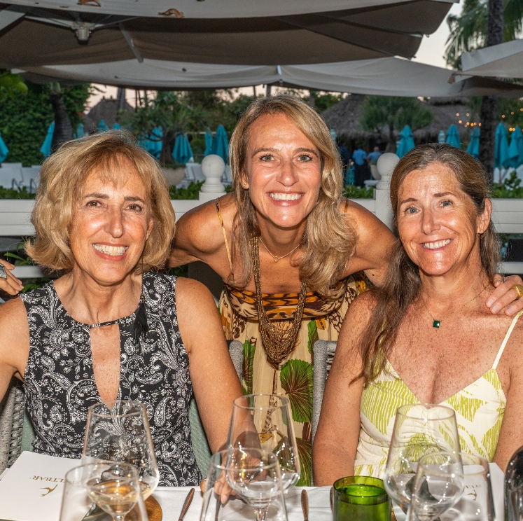 a group of women sitting at a table