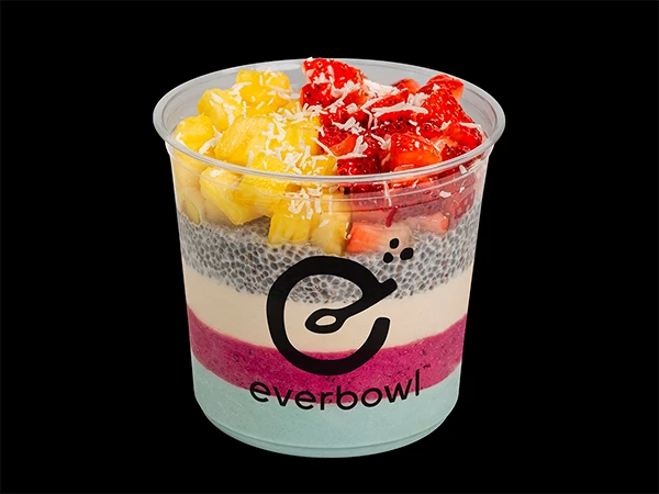 a plastic cup of fruit and chia pudding