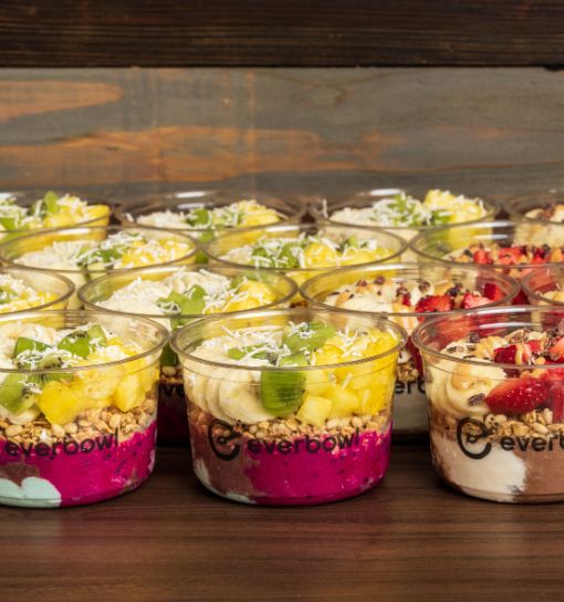 a group of cups of desserts