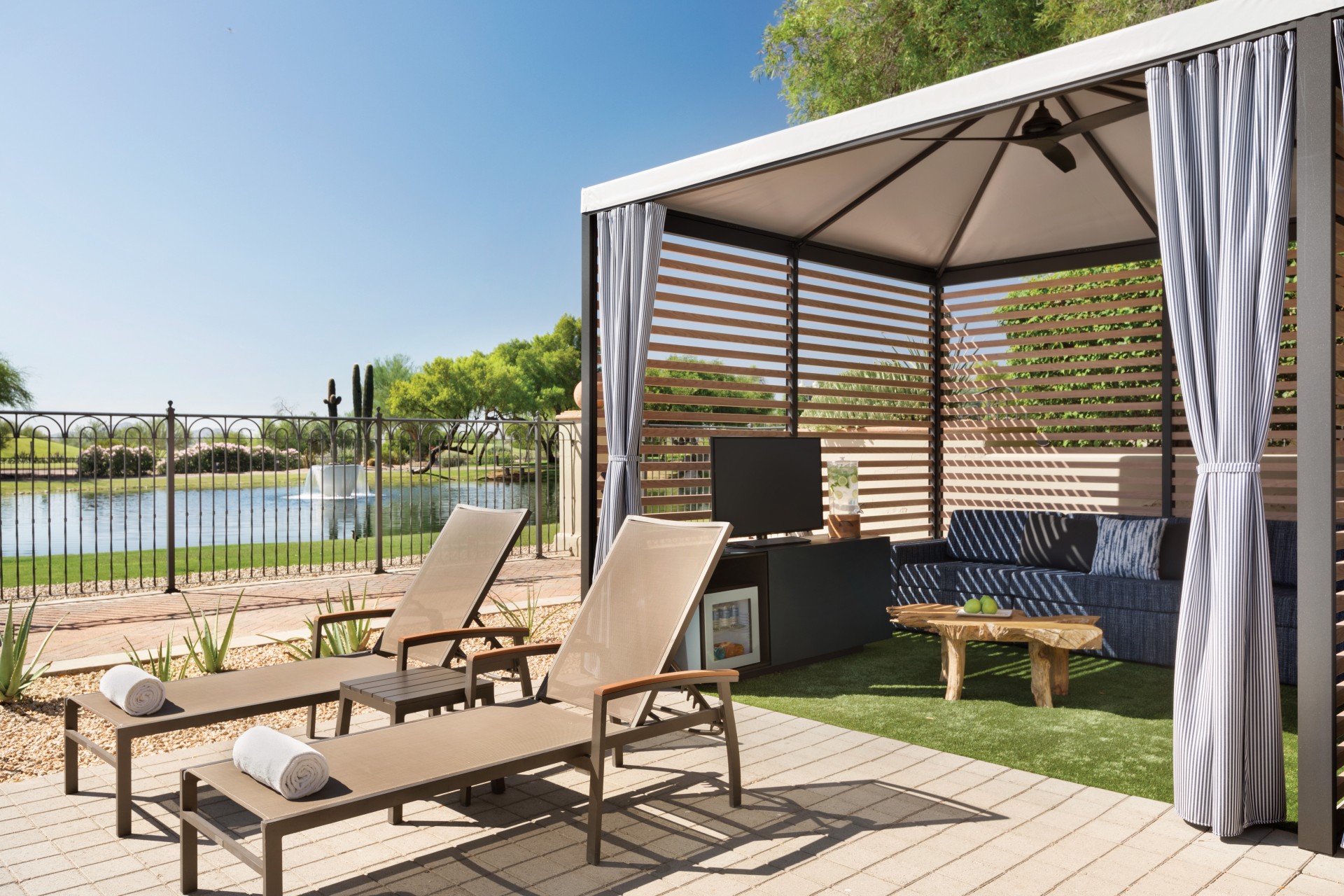 a patio with a covered patio and a television