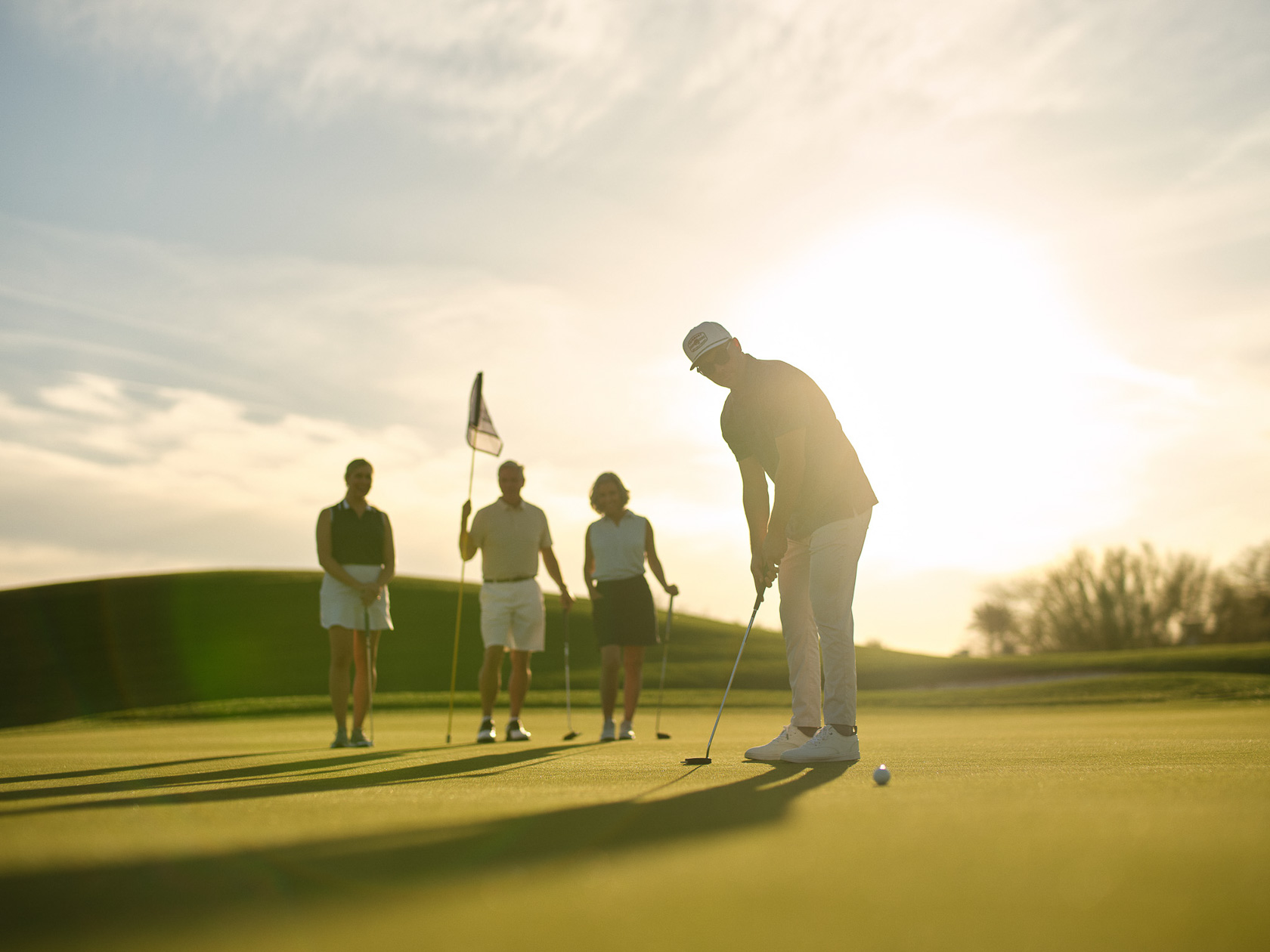 a group of people on a golf course
