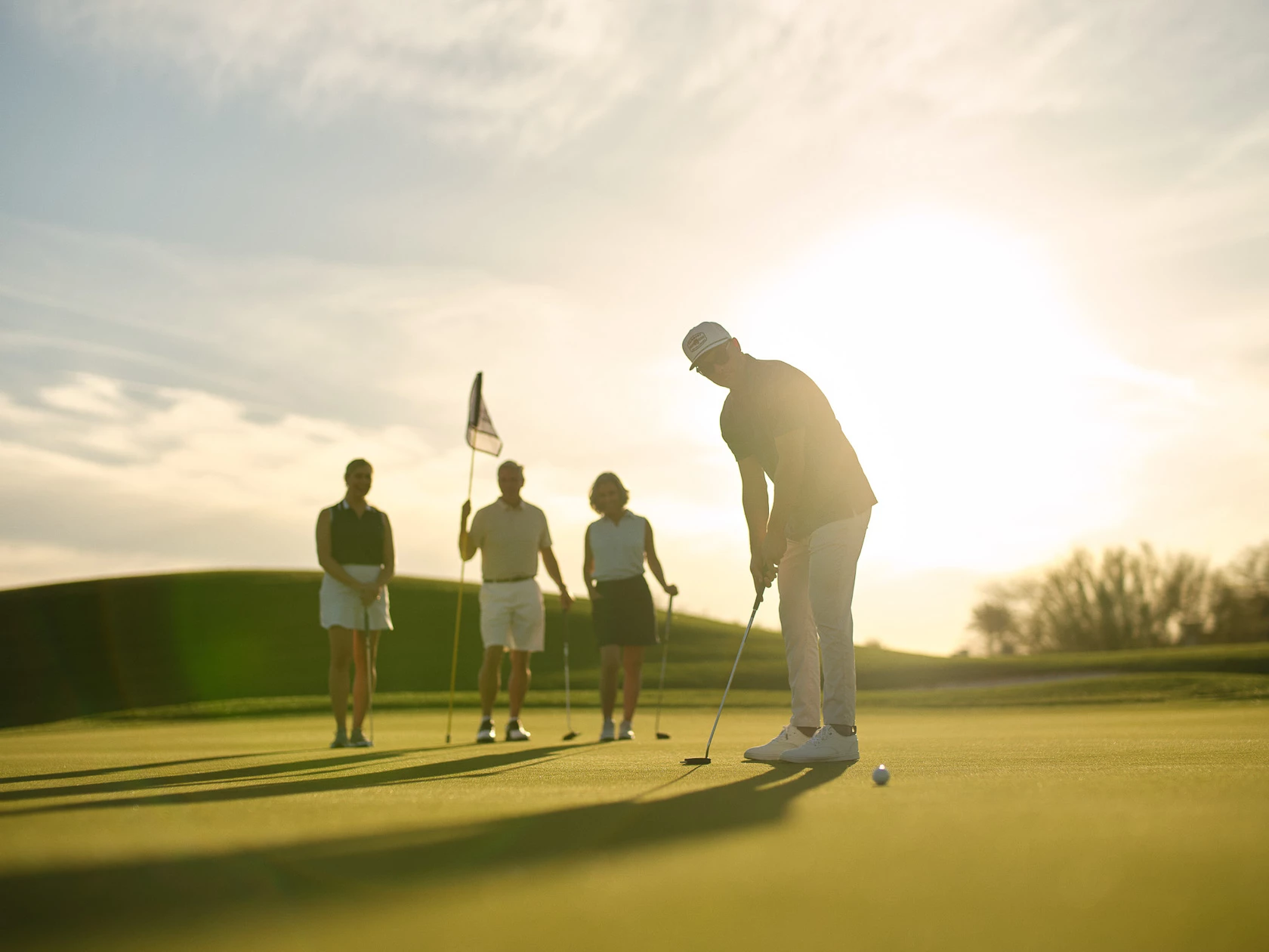 a group of people on a golf course