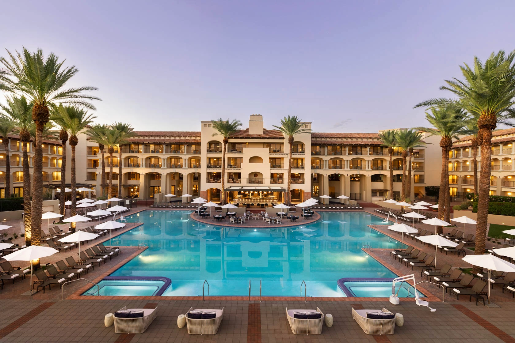 a large hotel with a pool