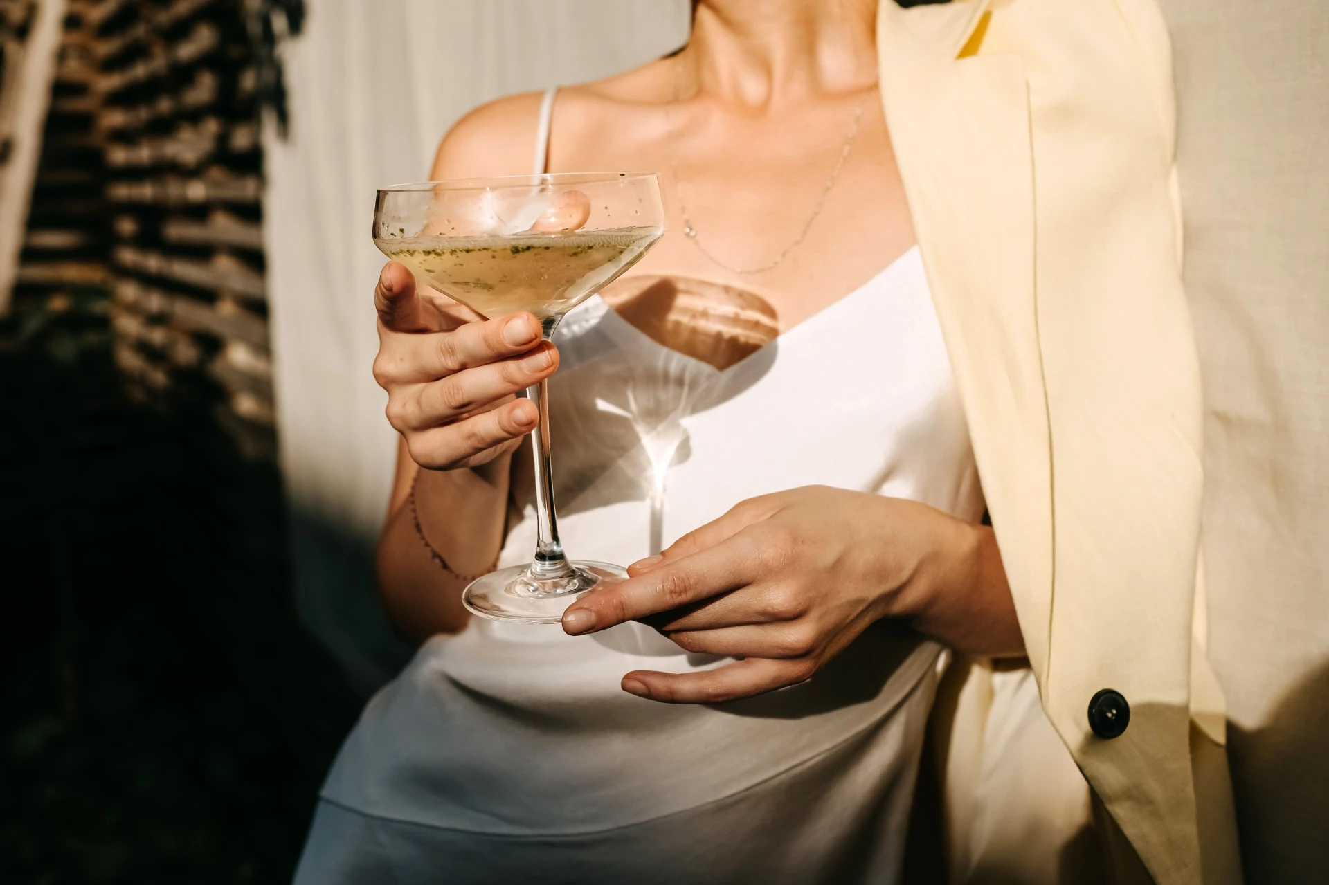 a woman holding a glass of champagne