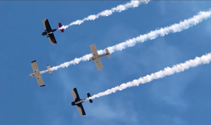 a group of airplanes flying in the sky