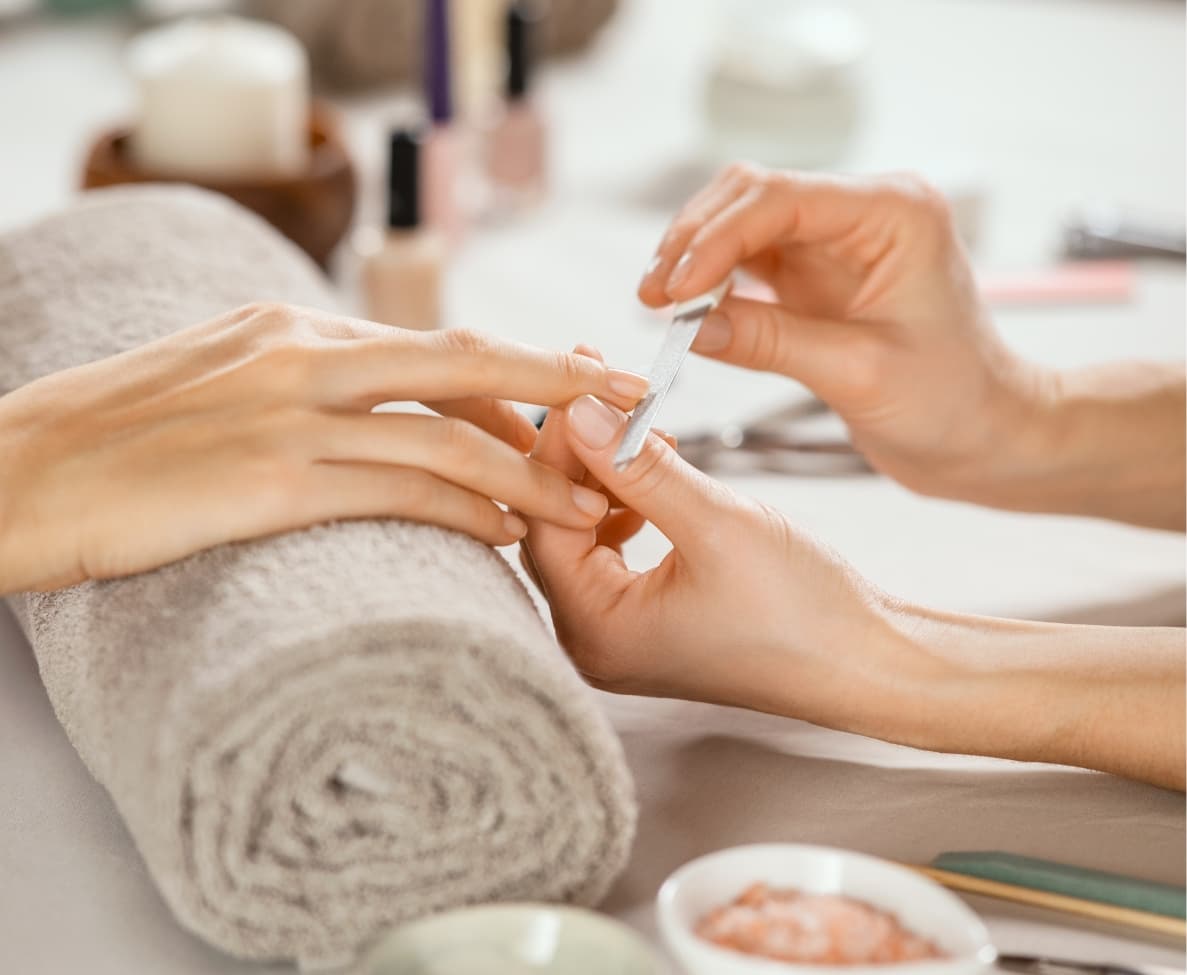a person getting a manicure done