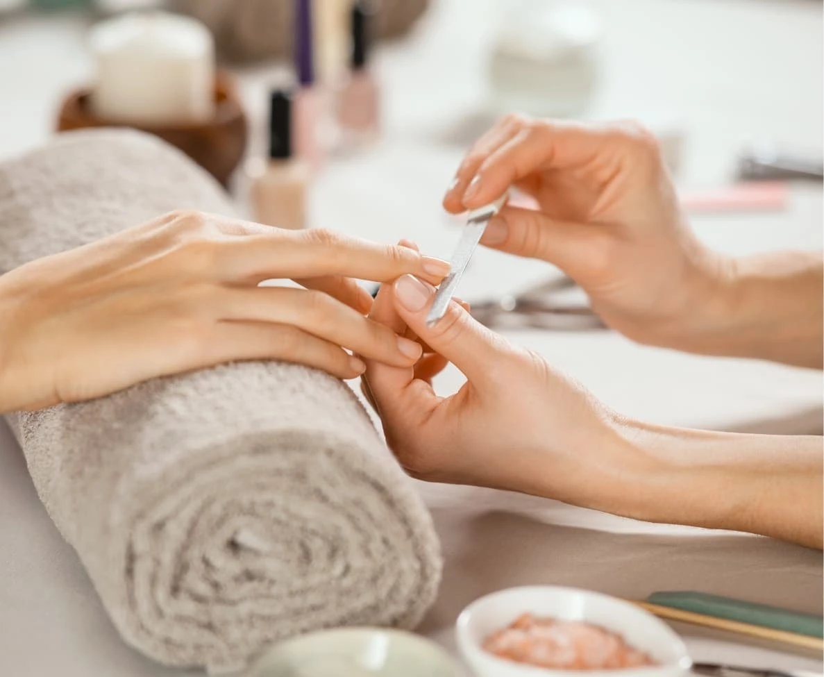 a person getting a manicure done