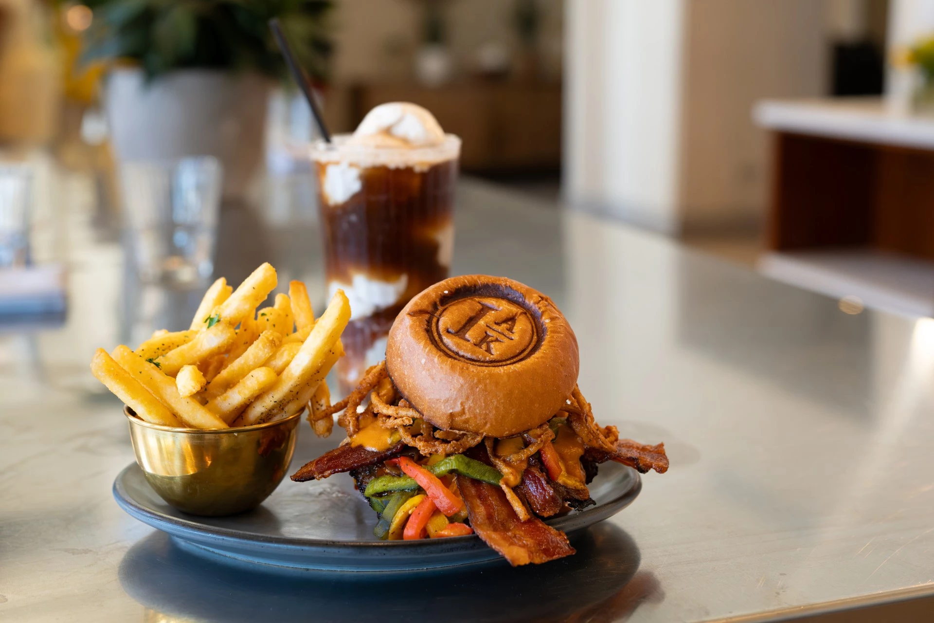 a plate of food with a drink and a sandwich