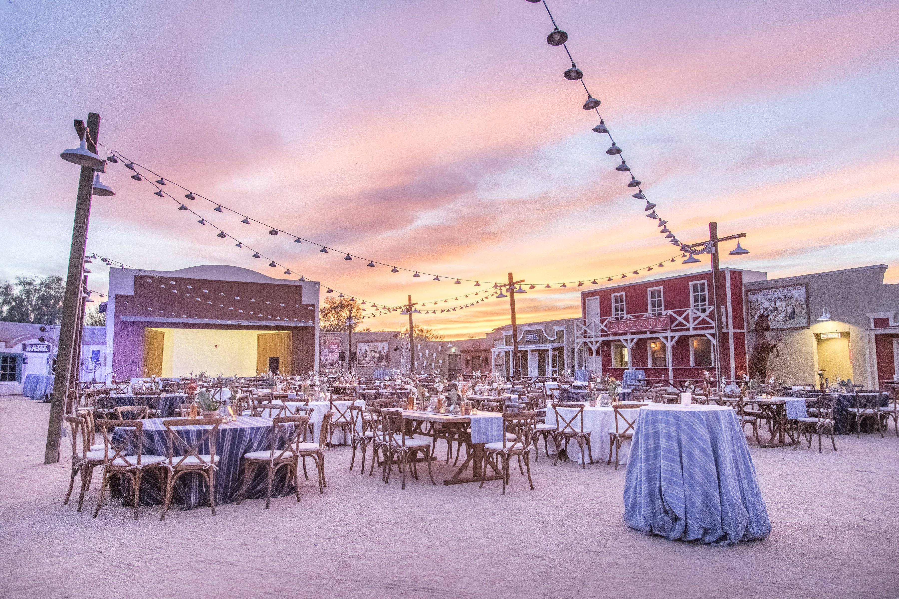 an outdoor venue with a western vibe at sunset