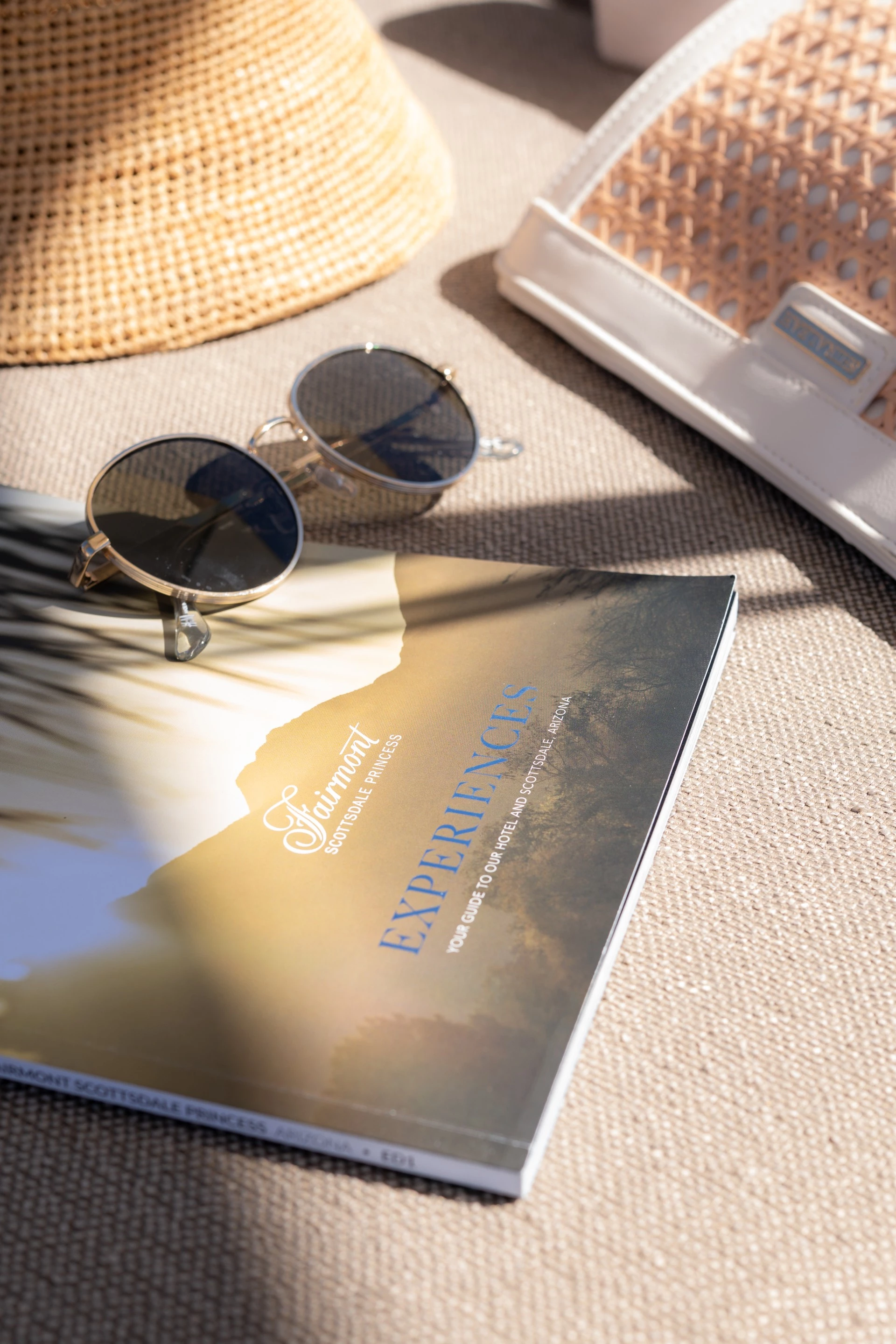 sunglasses and a hat on a book