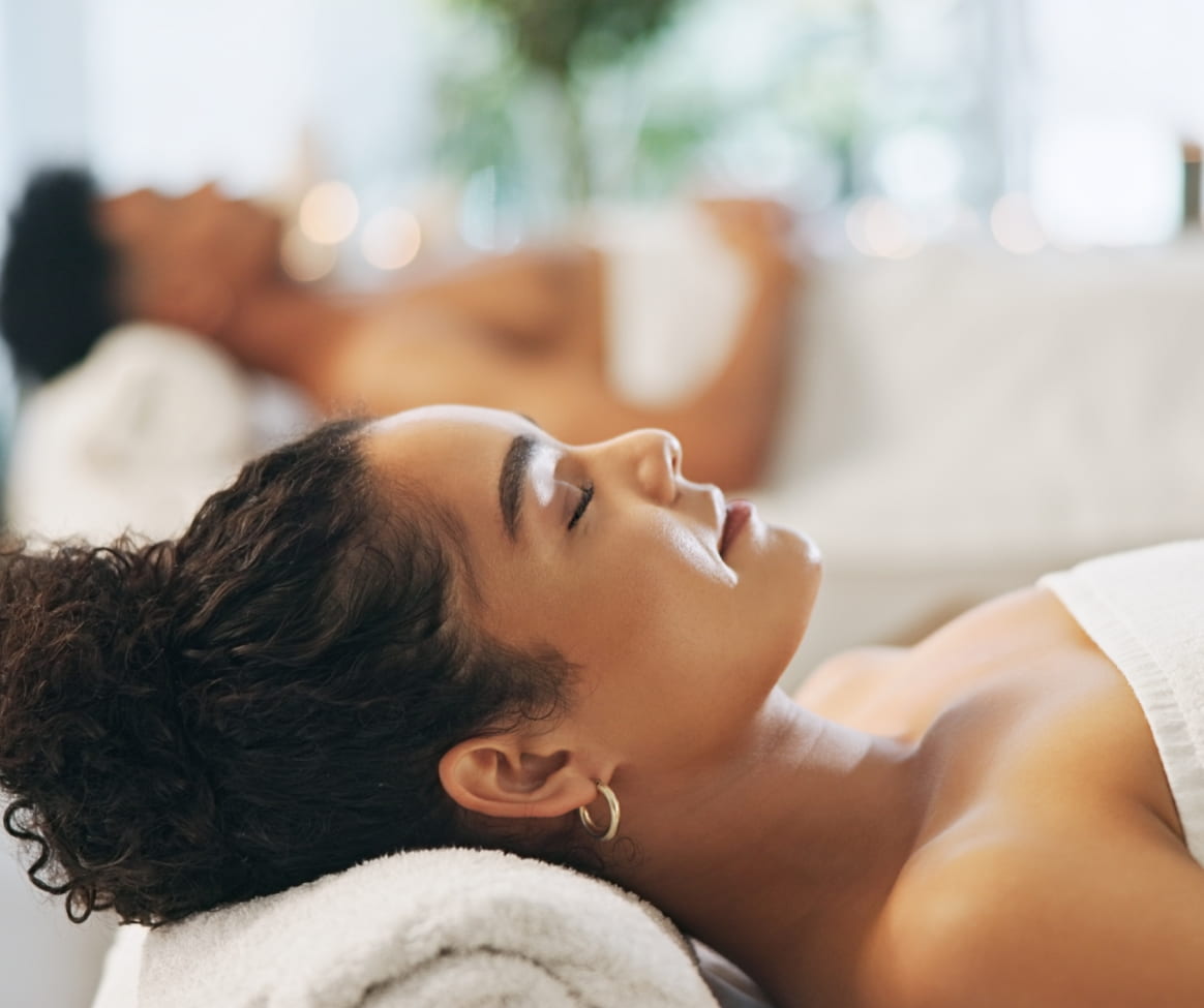 a woman lying on a massage table