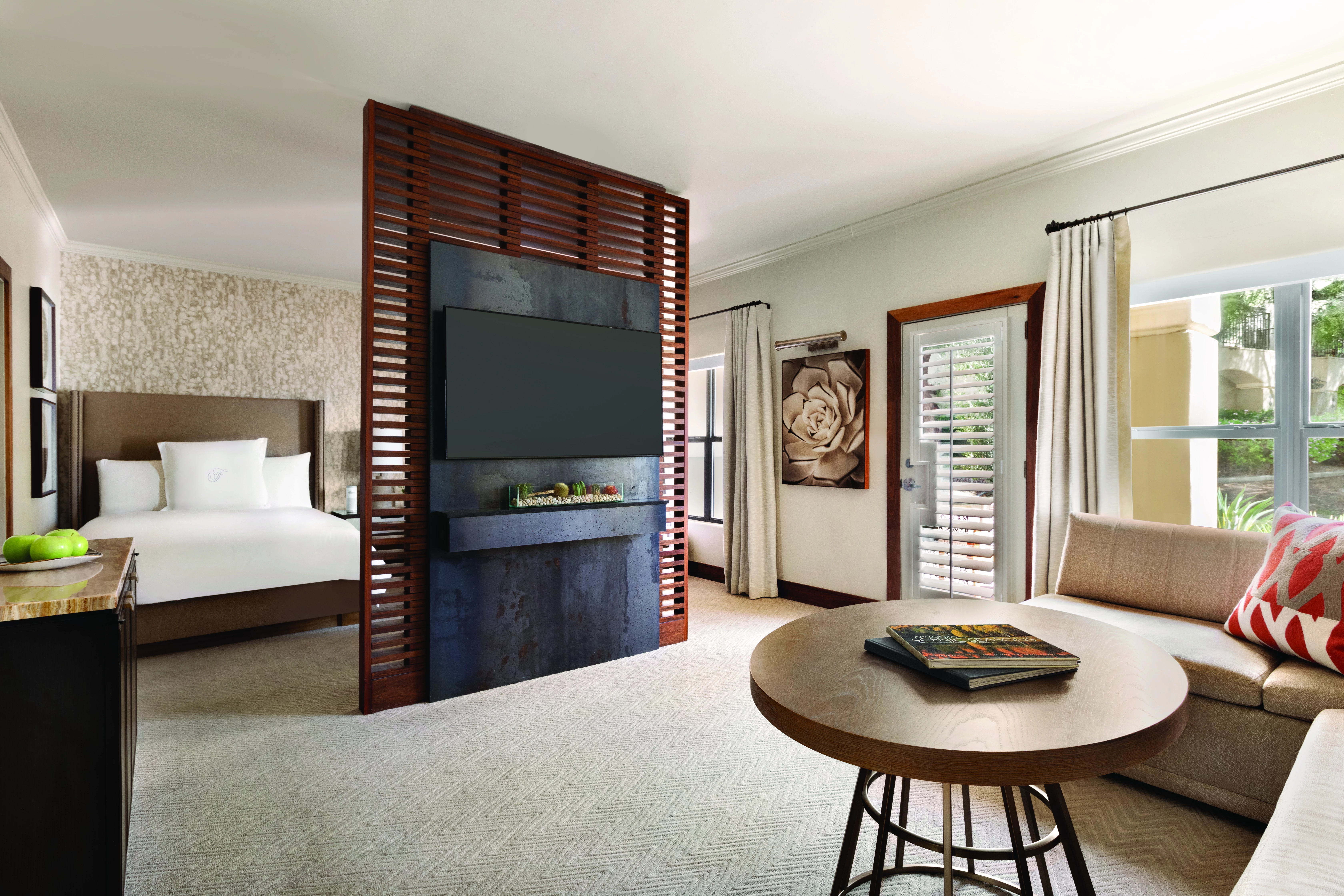fairmont gold room with a tv and a large sofa 