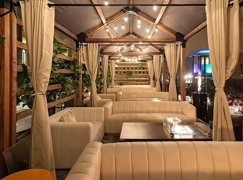 a room with white couches and tables