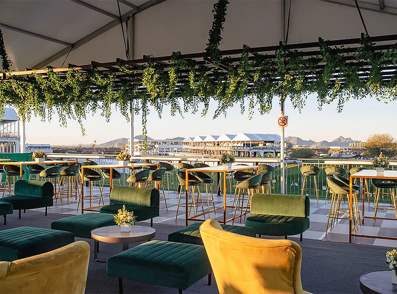 a patio with chairs and tables
