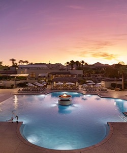a pool with a building in the background