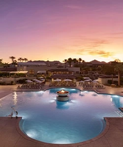 a pool with a building in the background