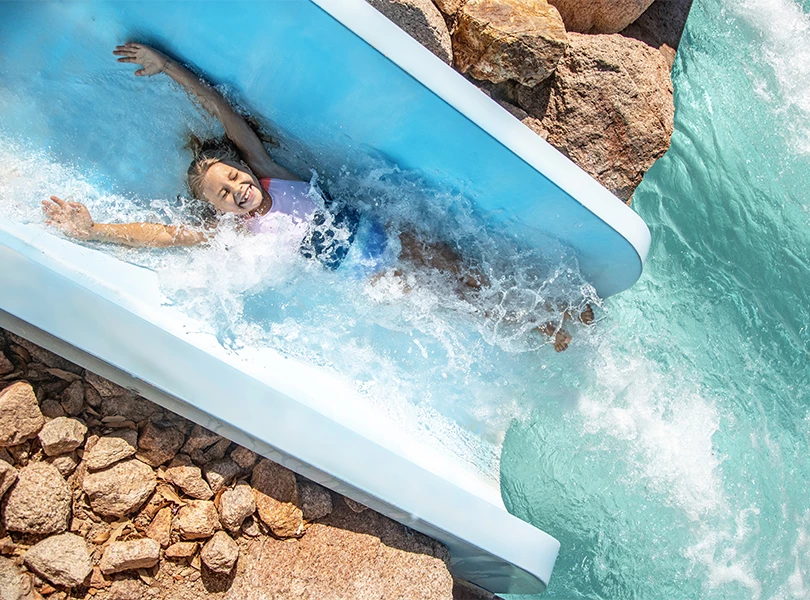 a girl on a water slide
