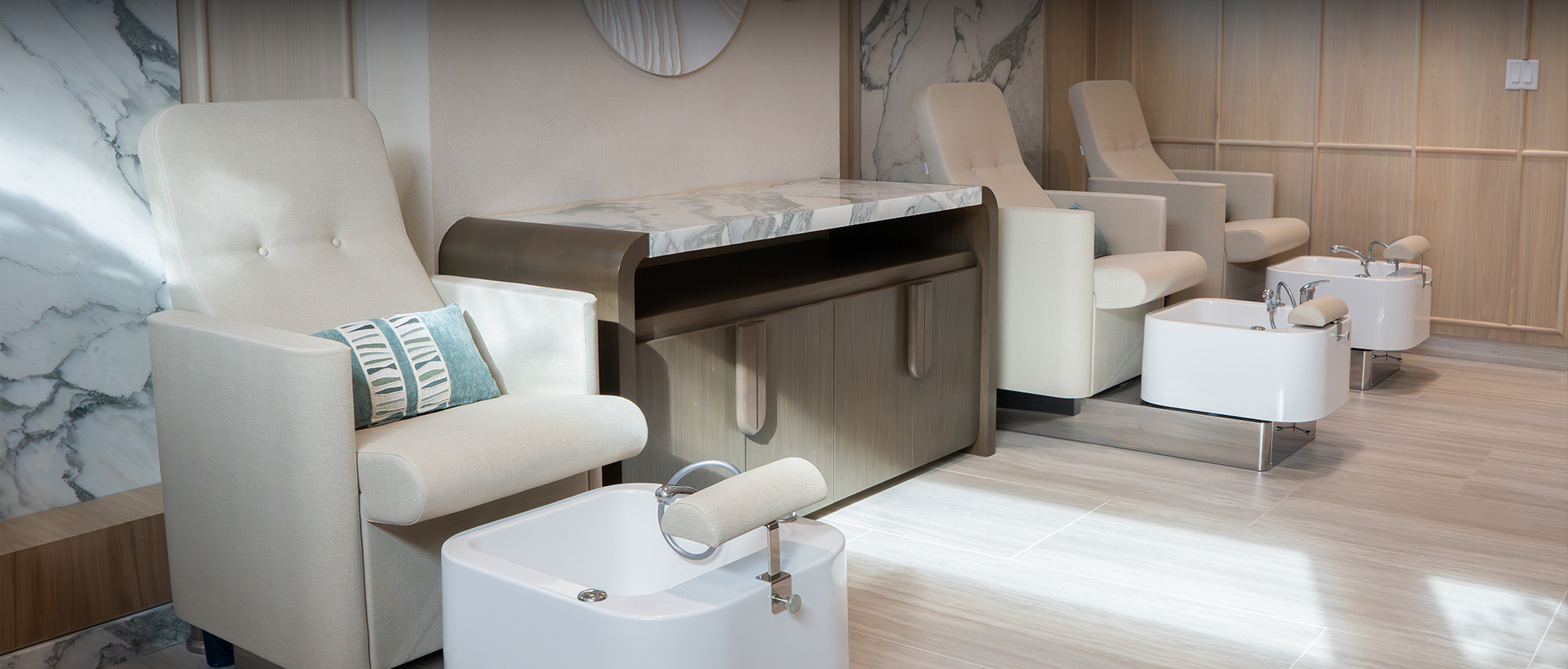 a room with a marble counter and chairs