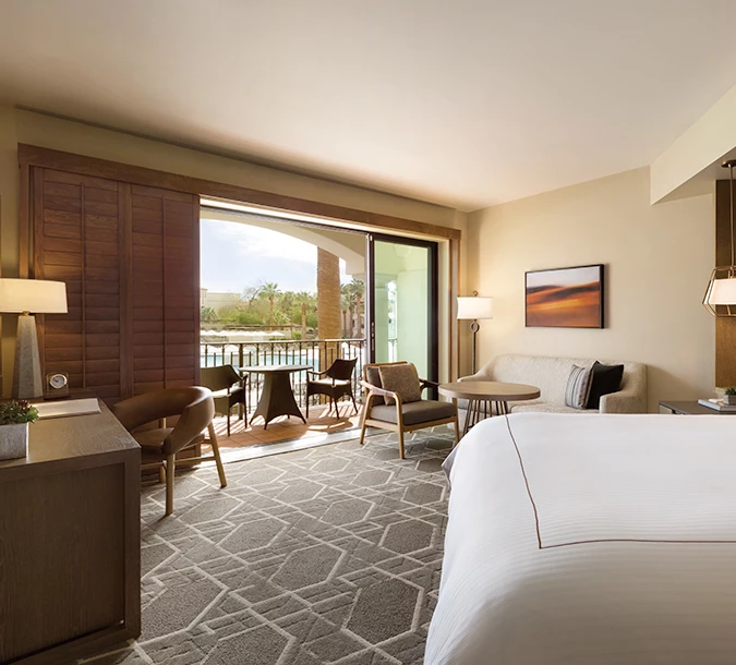 bedroom with a pool view, a double bed and a balcony
