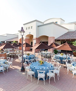 plaza with blue tables around 