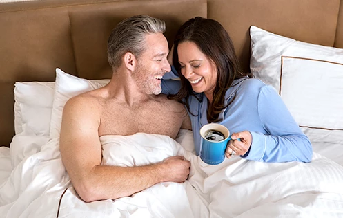 A couple having breakfast at bed
