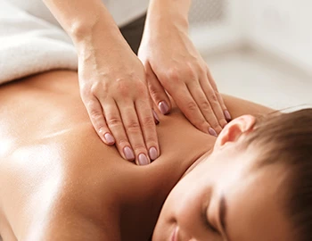 A woman receiving a back massage