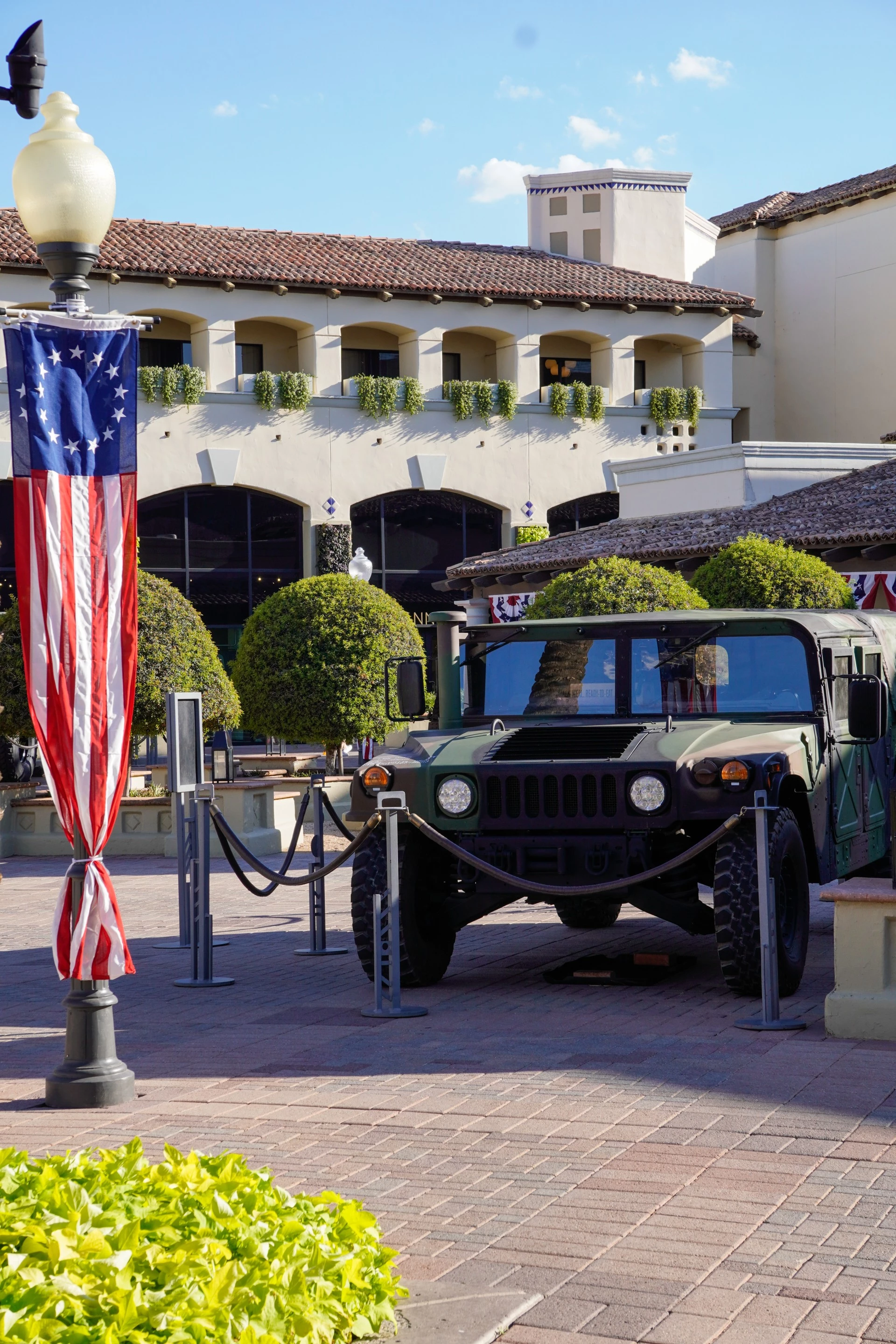 a military vehicle parked in front of a building