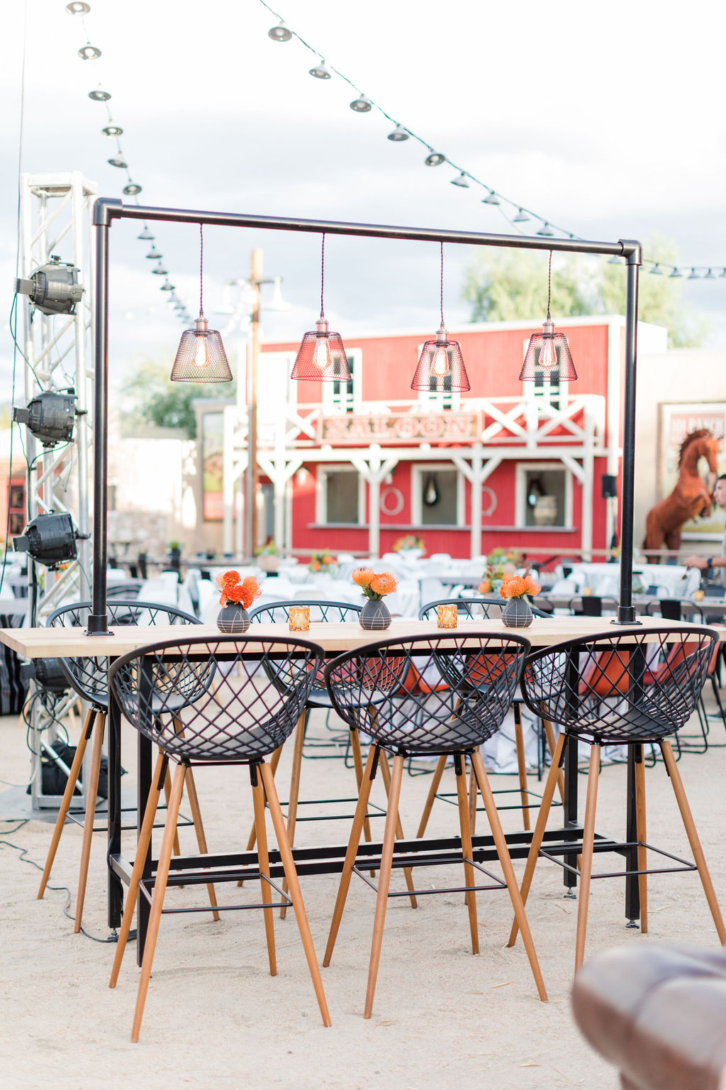 a table with chairs and a building in the background