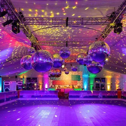 a building with a large group of balloons from the ceiling