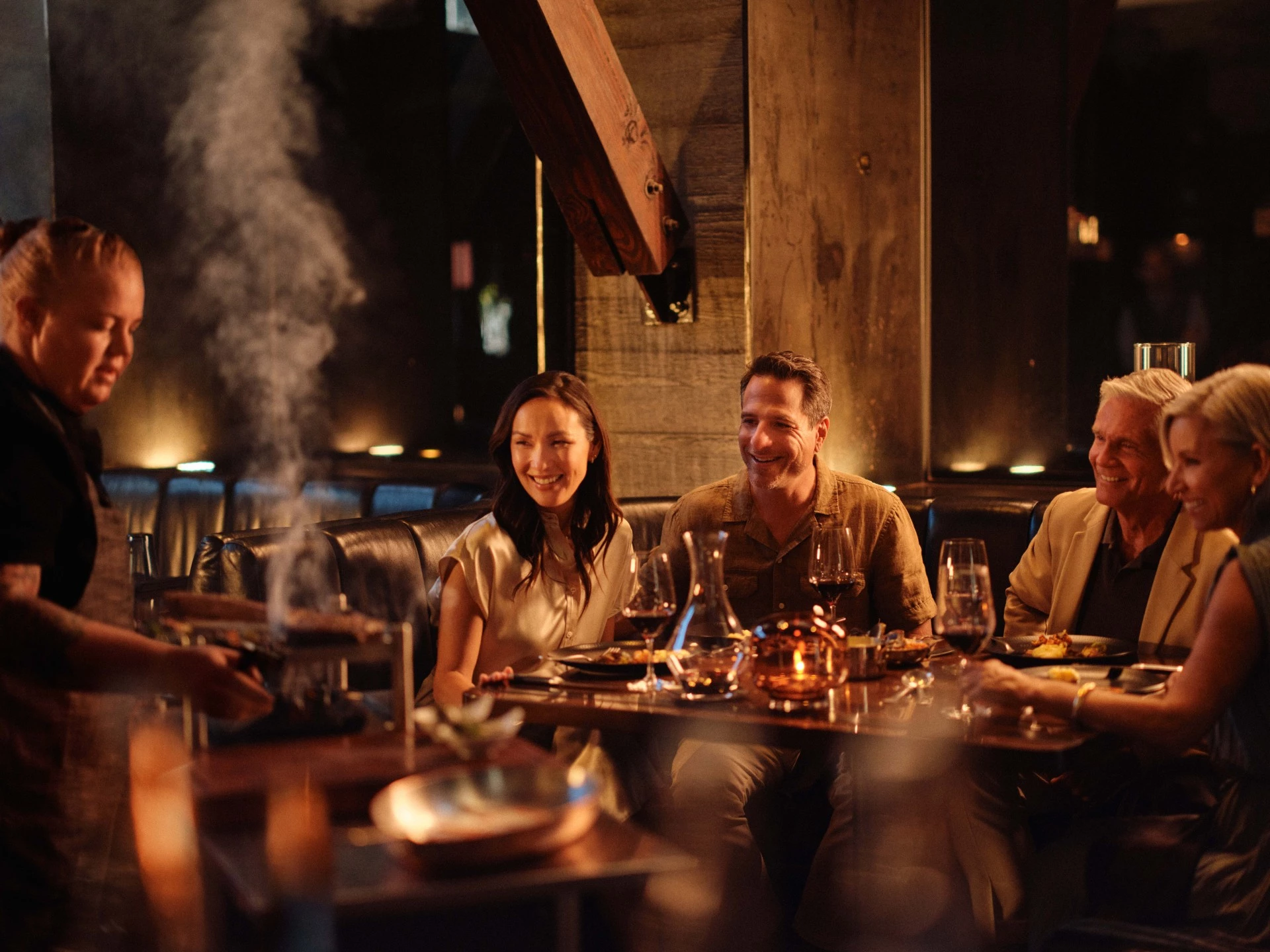 a group of people sitting at a table