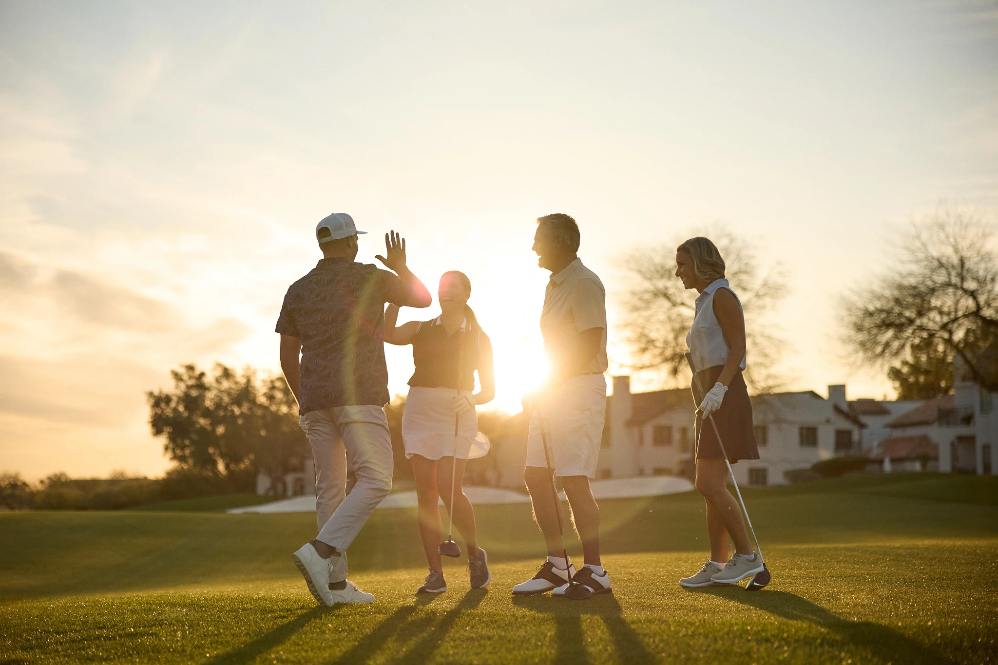 a group of people on a golf course
