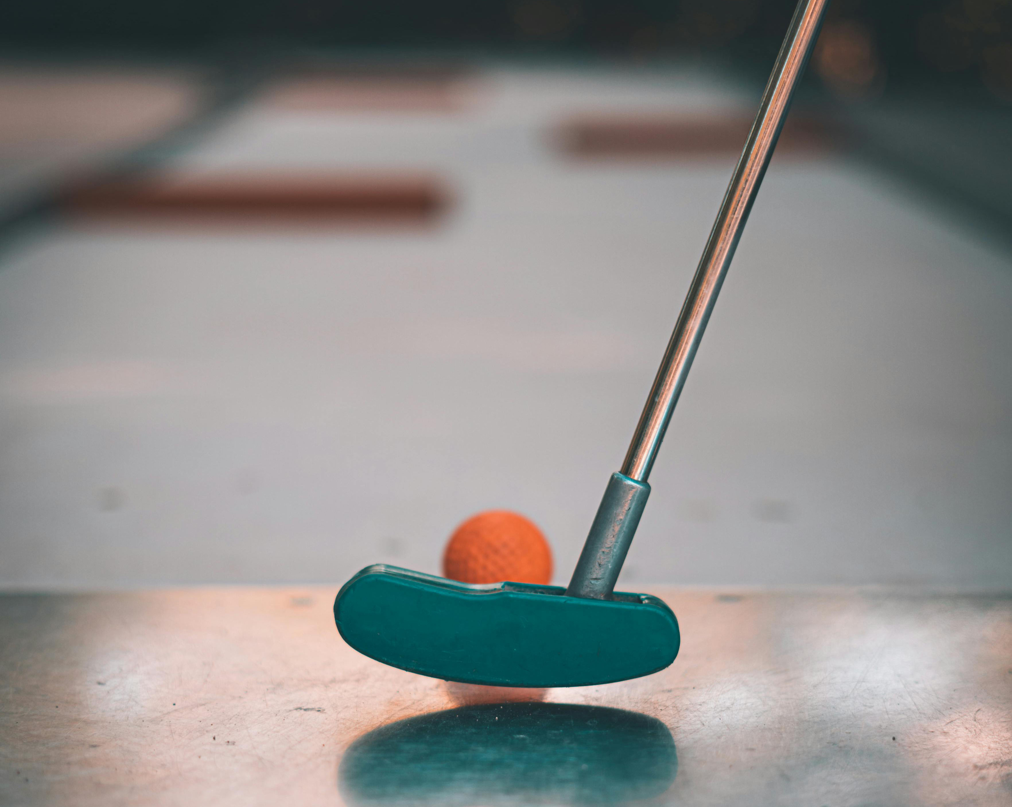 a golf club and a ball